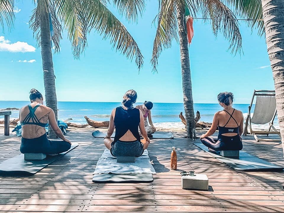 people talking on the beach at a church retreat that changes lives