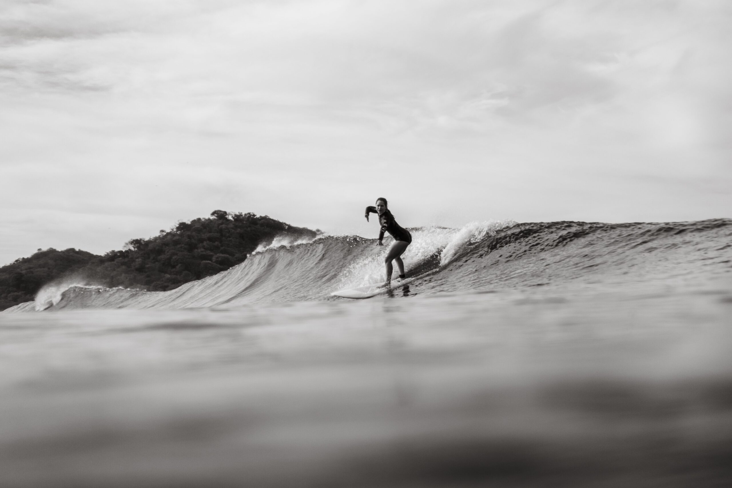 Man surfing a wave and learning about surrender