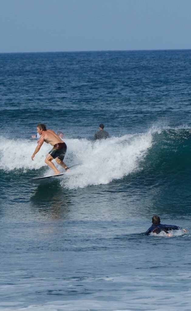 Surfing after a paddle out circle surf tradition