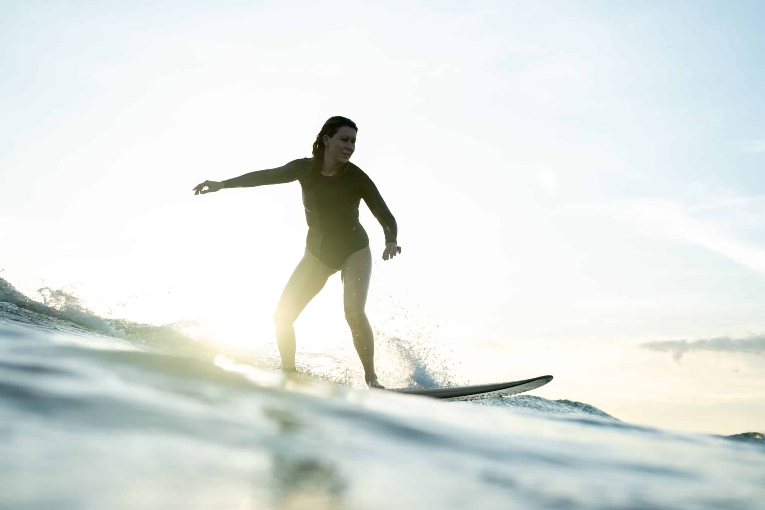 surfer on the wave after a retreat community service day