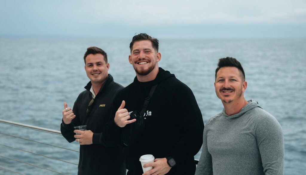 pastor and men by ocean