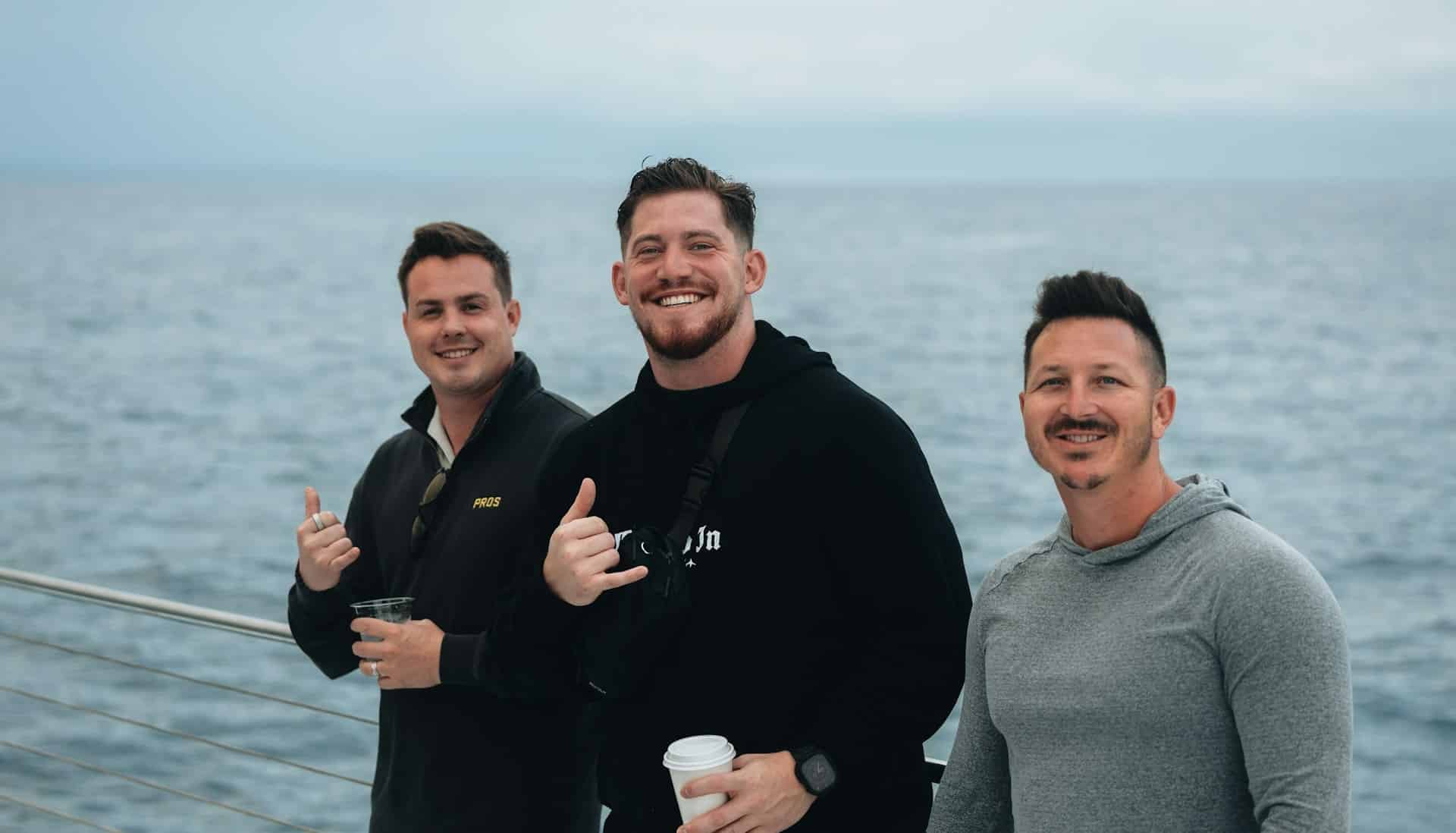pastor and men by ocean